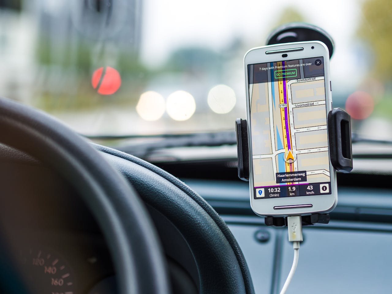 Services Smartphone mounted in car using GPS for navigation and directions.